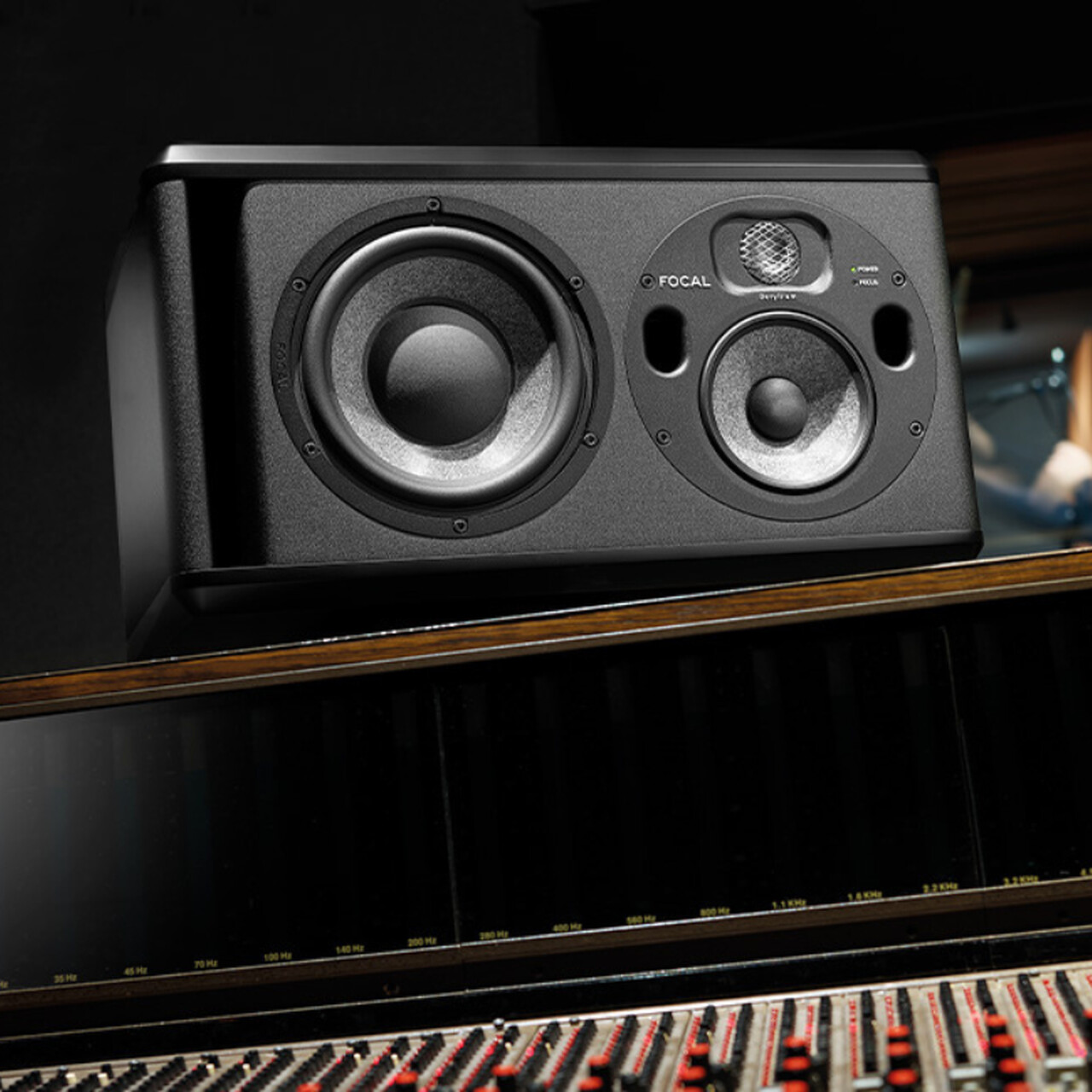 Focal Trio6 Black studio monitor, positioned horizontally in a recording studio.